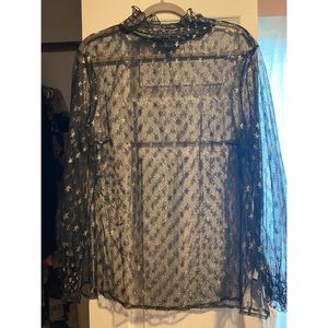 Black see-through top with printed gold stars